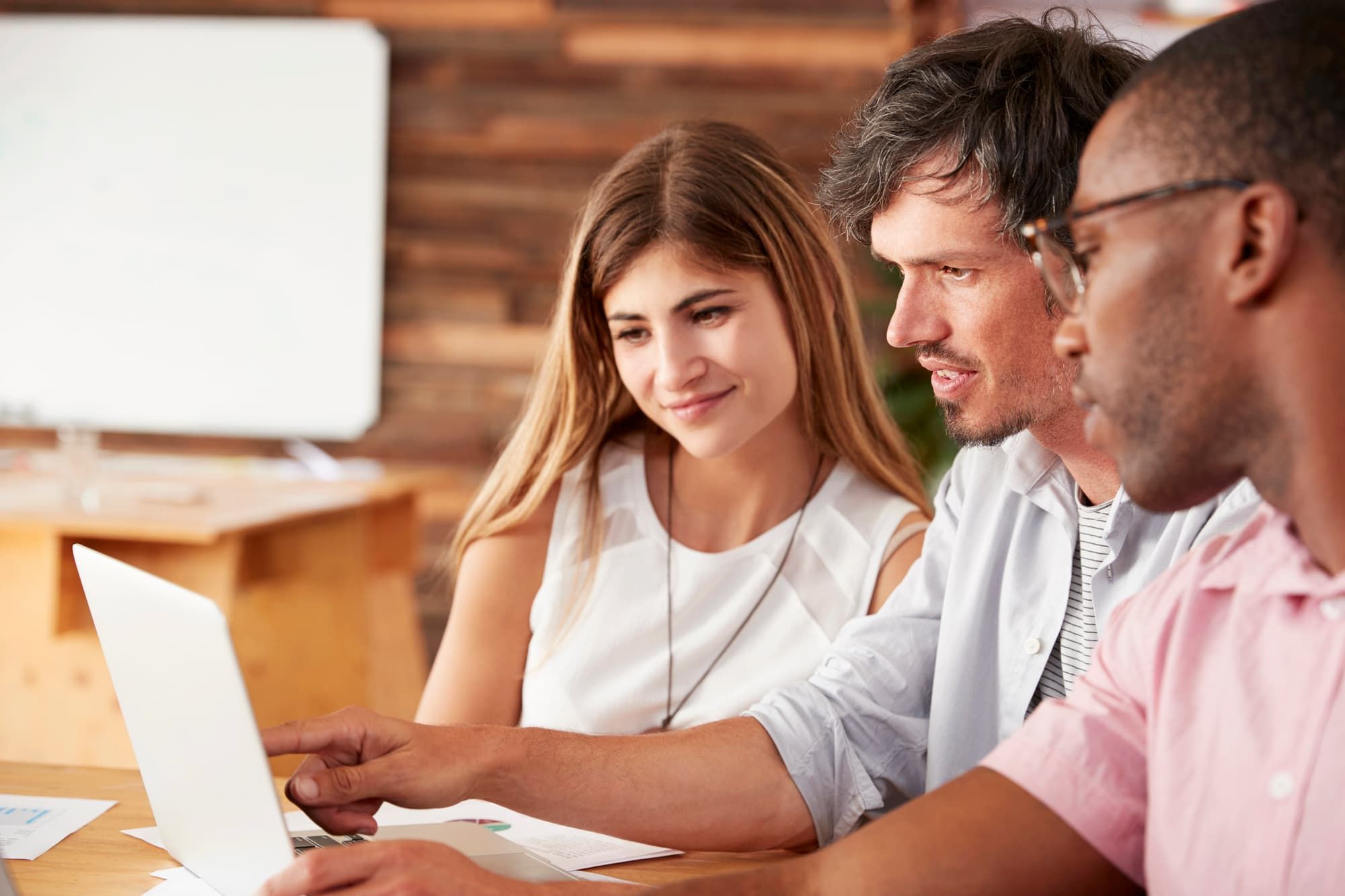 professionals working together on a laptop